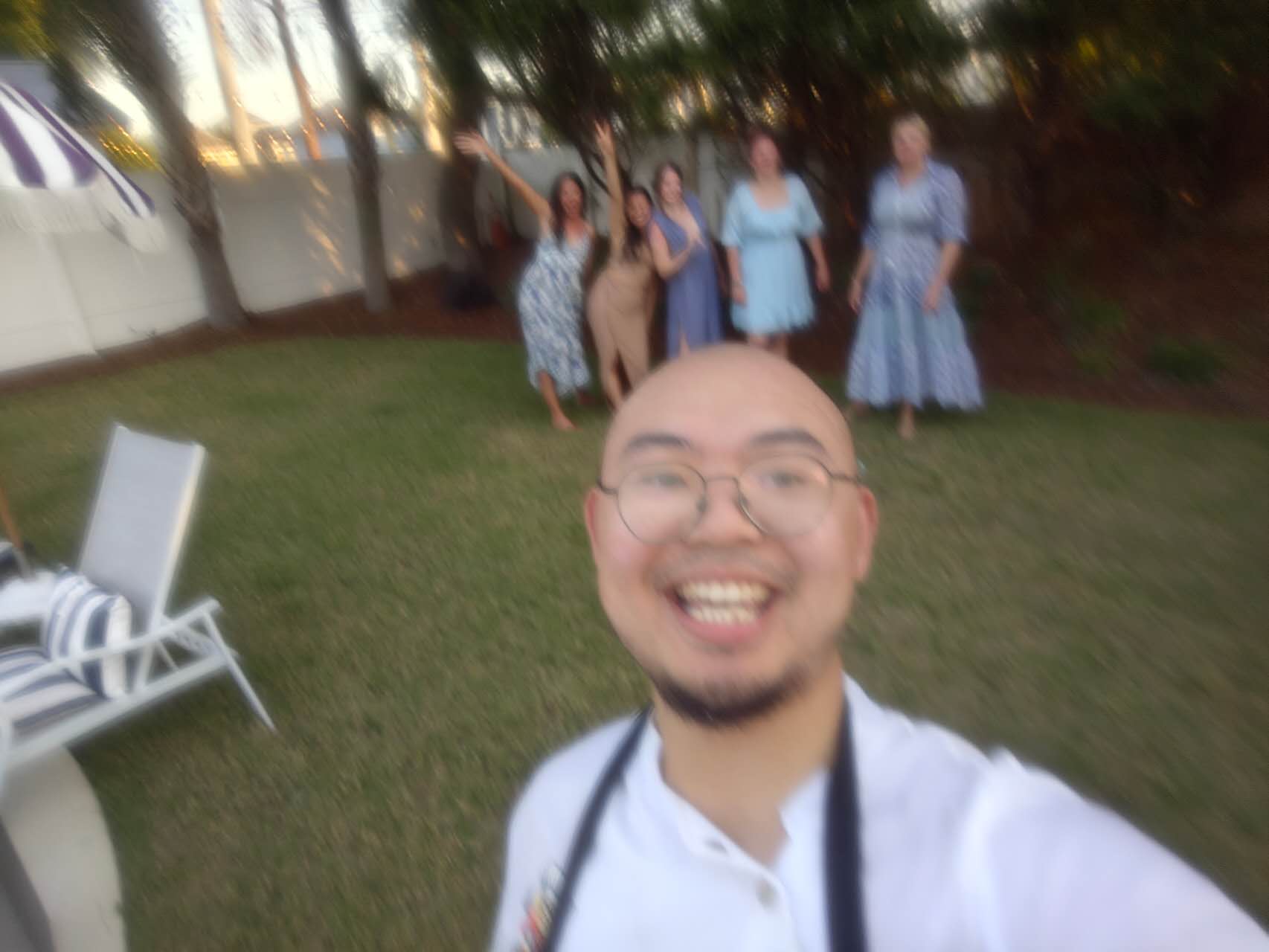 Hibachi chef taking selfie with happy customers celebrating in background